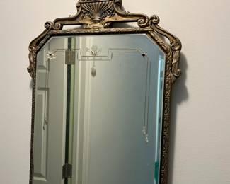 P44 - $75. Antique Wall Mirror by Boston Mirror Co. Measures 17" x 35" tall.