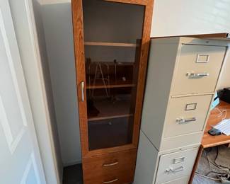 P36 - $40. Palliser Cabinet. Measures 20" wide x 18" deep x 69" tall. Pressed wood in very good condition!