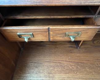 P25 - $150. Roll Top Wooden Desk. Measures 42" wide x 22" deep x 47" tall. Solid wood - Roll top closes easily.