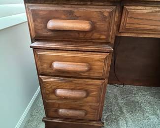 P25 - $150. Roll Top Wooden Desk. Measures 42" wide x 22" deep x 47" tall. Solid wood - Roll top closes easily.