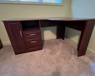 P31 - $30. Office Desk. In good condition and sturdy! Measures 58" long x 19.5" deep on one side and 39" deep on the larger side.