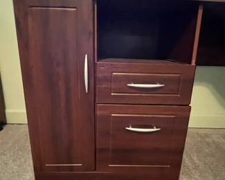 P31 - $30. Office Desk. In good condition and sturdy! Measures 58" long x 19.5" deep on one side and 39" deep on the larger side.