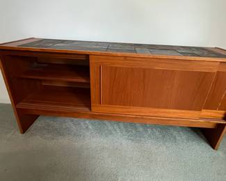 P7 - $100. Gangso Mobler Teak & Slate Credenza. Needs repair - one handle is broken. Generally needs tightened up. Measures 66.5" wide x 17.75" deep x 30" tall.