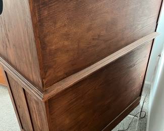 P25 - $150. Roll Top Wooden Desk. Measures 42" wide x 22" deep x 47" tall. Solid wood - Roll top closes easily.