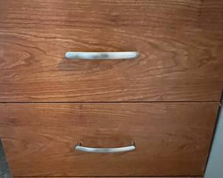 P36 - $40. Palliser Cabinet. Measures 20" wide x 18" deep x 69" tall. Pressed wood in very good condition!