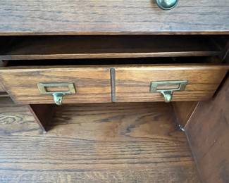 P25 - $150. Roll Top Wooden Desk. Measures 42" wide x 22" deep x 47" tall. Solid wood - Roll top closes easily.