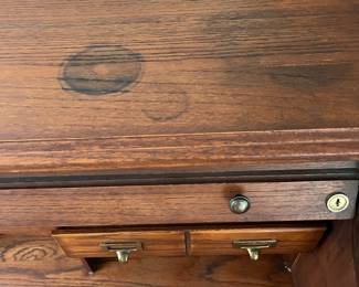 P25 - $150. Roll Top Wooden Desk. Measures 42" wide x 22" deep x 47" tall. Solid wood - Roll top closes easily.