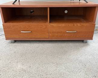 P27 - $10. Media Cabinet. Measures 49" x 21" deep x 21.5" tall. Pressed wood but in good condition!
