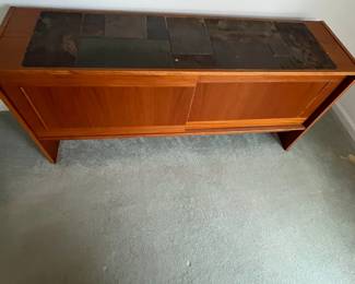 P7 - $100. Gangso Mobler Teak & Slate Credenza. Needs repair - one handle is broken. Generally needs tightened up. Measures 66.5" wide x 17.75" deep x 30" tall.