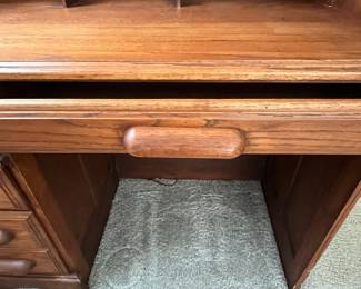 P25 - $150. Roll Top Wooden Desk. Measures 42" wide x 22" deep x 47" tall. Solid wood - Roll top closes easily.