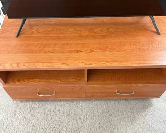 P27 - $10. Media Cabinet. Measures 49" x 21" deep x 21.5" tall. Pressed wood but in good condition!