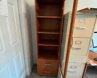 P36 - $40. Palliser Cabinet. Measures 20" wide x 18" deep x 69" tall. Pressed wood in very good condition!