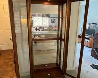 P22 - $225. American of Martinsville Lighted Display Cabinet. Measures 31" wide x 12.5" deep x 74" tall. 4 glass shelves are all adjustable.