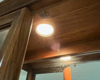 P22 - $225. American of Martinsville Lighted Display Cabinet. Measures 31" wide x 12.5" deep x 74" tall. 4 glass shelves are all adjustable.