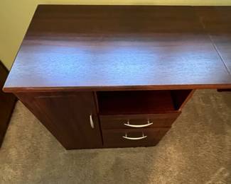 P31 - $30. Office Desk. In good condition and sturdy! Measures 58" long x 19.5" deep on one side and 39" deep on the larger side.