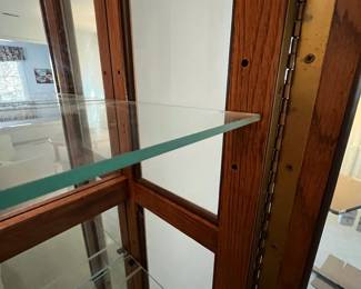 P22 - $225. American of Martinsville Lighted Display Cabinet. Measures 31" wide x 12.5" deep x 74" tall. 4 glass shelves are all adjustable.