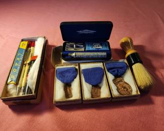 1927 medals, old Anheiser Bush pens and Gillette razor