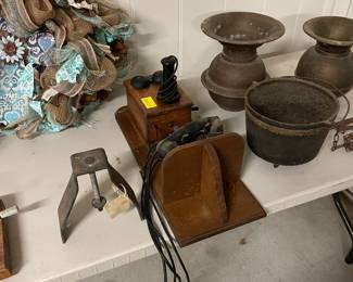 Metal bracket to hold phone insulator. The phones where “tied” together to give a hand held ear piece 