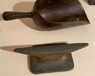 Old cast seed scoop or small cast cleat