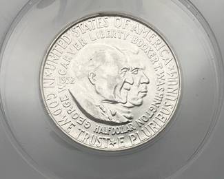 1952 George Washington Carver - Booker T. Washington Half Dollar, honoring the lives and achievements of the two men. Graded AU 58 Details by ANACS. Scratched.