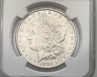 1882 Morgan Dollar, graded MS 63 by Numismatic Guaranty Company.