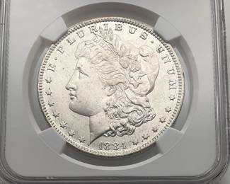 1884-O US Morgan Silver Dollar . New Orleans Mint. Certified as Near Gem Uncirculated (MS64) by NGC.