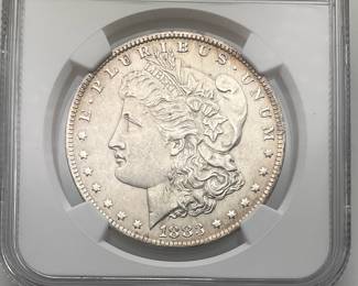 1883 Morgan Dollar, graded MS 61 by Numismatic Guaranty Company.