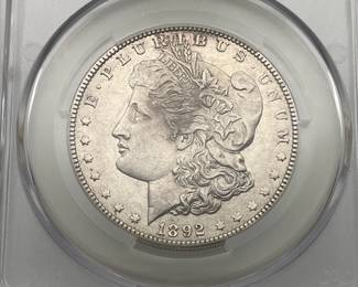 1892-O Morgan Dollar, graded AU Details by CAC. Harshly Cleaned.