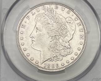 1886-O Morgan Dollar, graded AU Details by CAC. Harshly Cleaned.