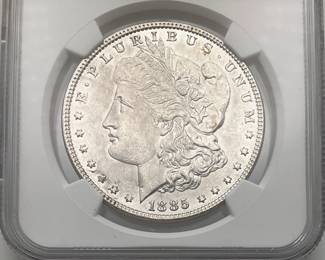 1885 Morgan Dollar, graded MS 63 by the Numismatic Guaranty Company.