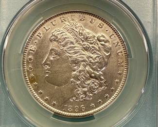 1896 Morgan Dollar, graded AU Details by CAC. Harshly Cleaned.