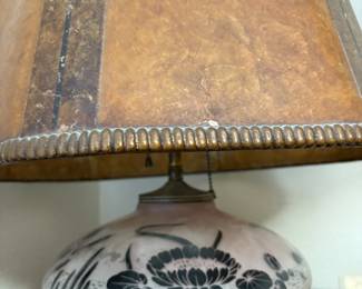 lamp hand-painted glass base and a rawhide or reverse-painted glass shade. 
Light fixture needs to be fixed $175