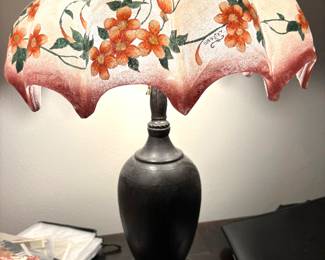 Lamp Reverse Painted Glass By Webster 20 th Century Art Glass Bronze Base. $12,000. Alice Carmen Webster Gouvy (1873–1959), most commonly known in the collecting world as Alice Webster.
She was an American glass decorator and enamel painter active during the Arts & Crafts period, particularly in the early 20th century (roughly 1900–1920s). Alice Webster specialized in hand-painted enameled leaded floral glass shades. Her lamps are highly collectible today and are distinctly recognized in the Arts & Crafts and American art glass market under the name “Webster” shades This shade is particularly valuable because it was made as a Chandelier. Mint Condition!
Call Donna 850-516-2425