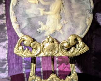 Genuine Incolay Stone. An artisan, mid century, pantented, composite stone made from rose quartz, onyx, and agate with colored resin and had inlaid white cameo design. 