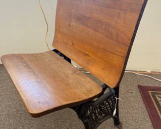 Antique wood and cast iron school chair with folding seat.
