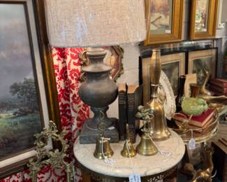 lamps, brass bells, framed art