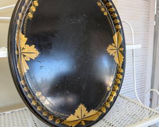 Vintage Black and gold painted toleware oval serving tray with a leaf pattern border