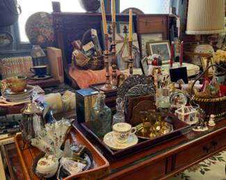 Brass candlesticks, lamps, tea cups and saucers, decor