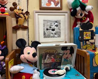 Vintage Disney record player, stuffed animals, wall art