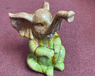 Ceramic Elephant figurine with a brown and green drip glaze