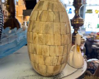 Decorative Egg Sculpture featuring a bone inlay or tessellated design.