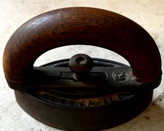 Antique cast iron "sad iron" with wooden handle