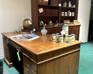 National Executive Desk, large volume book collections, steins and library hutch.