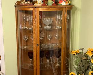 Vintage curved front oak display cabinet with lighted interior and key