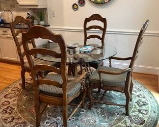 Very nice glass top table with four chairs in excellent condition. This item is up for pre-sale.