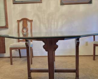 Transitional Octagonal Glass Dining Table with Asian-Inspired Fretwork Base
