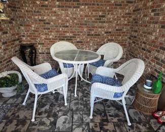 #54	White Plastic Wicker Round Table w/4 Chairs (kept inside patio) w/cushions - 38x30 Table 	 $150.00 
