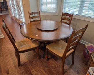 #69	Wood Round Table w/metal Base w/4 Wood Slat Back Chairs w/rushing Seats  - 54x30 Table Measurements	 $125.00 
