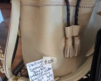 #105	Vintage Dooney & Bourke Pebbled Leather Drawstring Bucket Bag (interior ink marks)	 $50.00 
