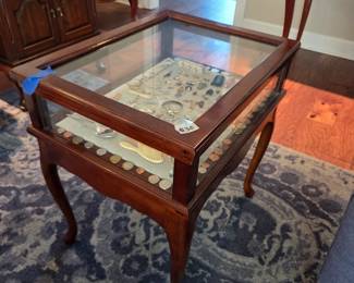 #30	Wood Display Table w/flip-up Glass top w/side drawer - 17.5x22x23.5	 $75.00 (contents not included)
